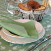 Tovaglia rotonda Mymami in cotone biologico fruits verde con piatti e tovaglioli 